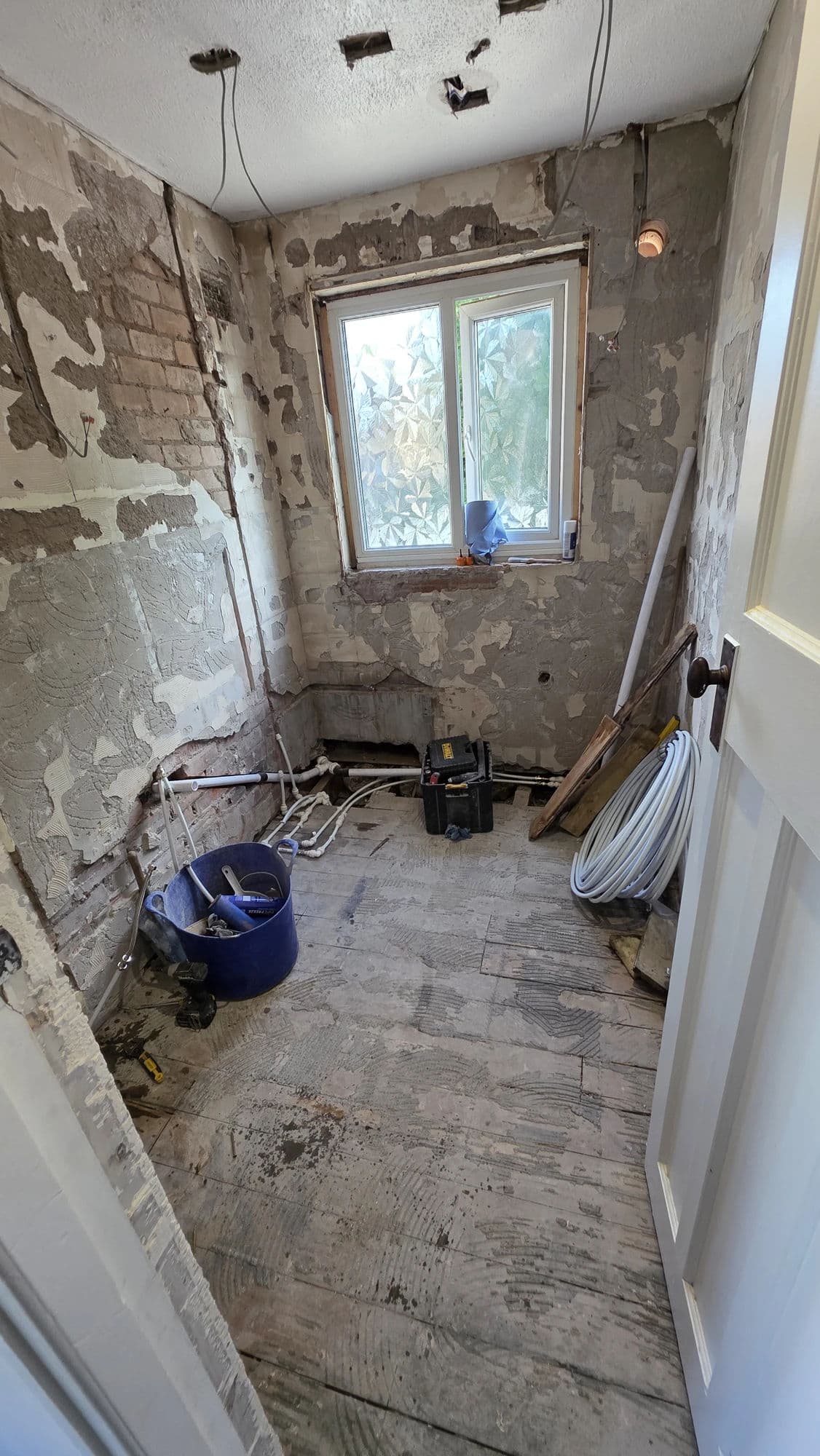 Bathroom Refurbishment Norton with Walk-In Shower and Patterned Floor in Stockton-on-Tees — before work began. Services: Bathroom Installation, Bathroom Renovation, Bathroom Refurbishment, Bathroom Tiling, Shower Installation, Flooring, Plumbing, Lighting.