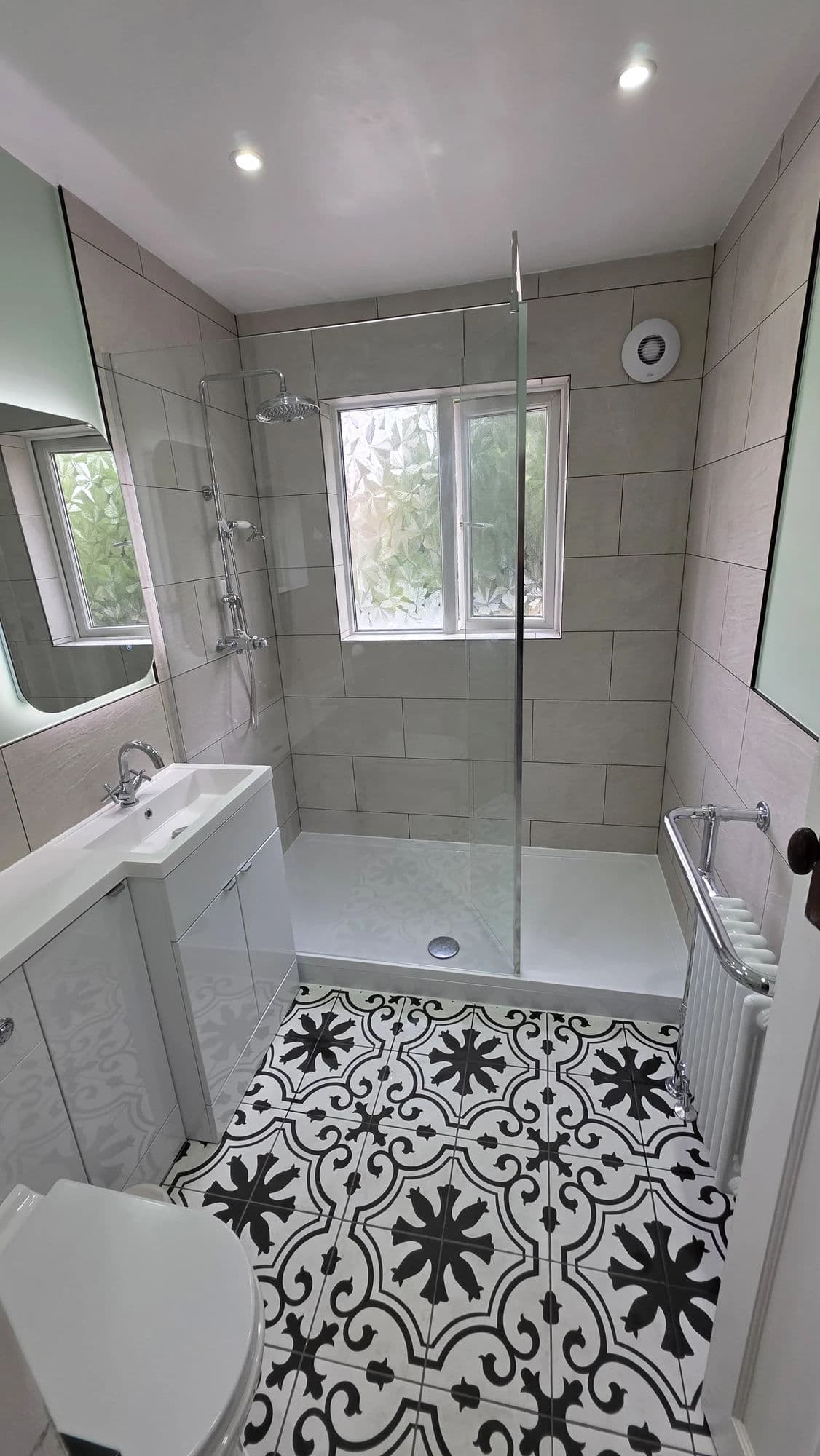 Bathroom Refurbishment Norton with Walk-In Shower and Patterned Floor in Stockton-on-Tees — after completion. Services: Bathroom Installation, Bathroom Renovation, Bathroom Refurbishment, Bathroom Tiling, Shower Installation, Flooring, Plumbing, Lighting.