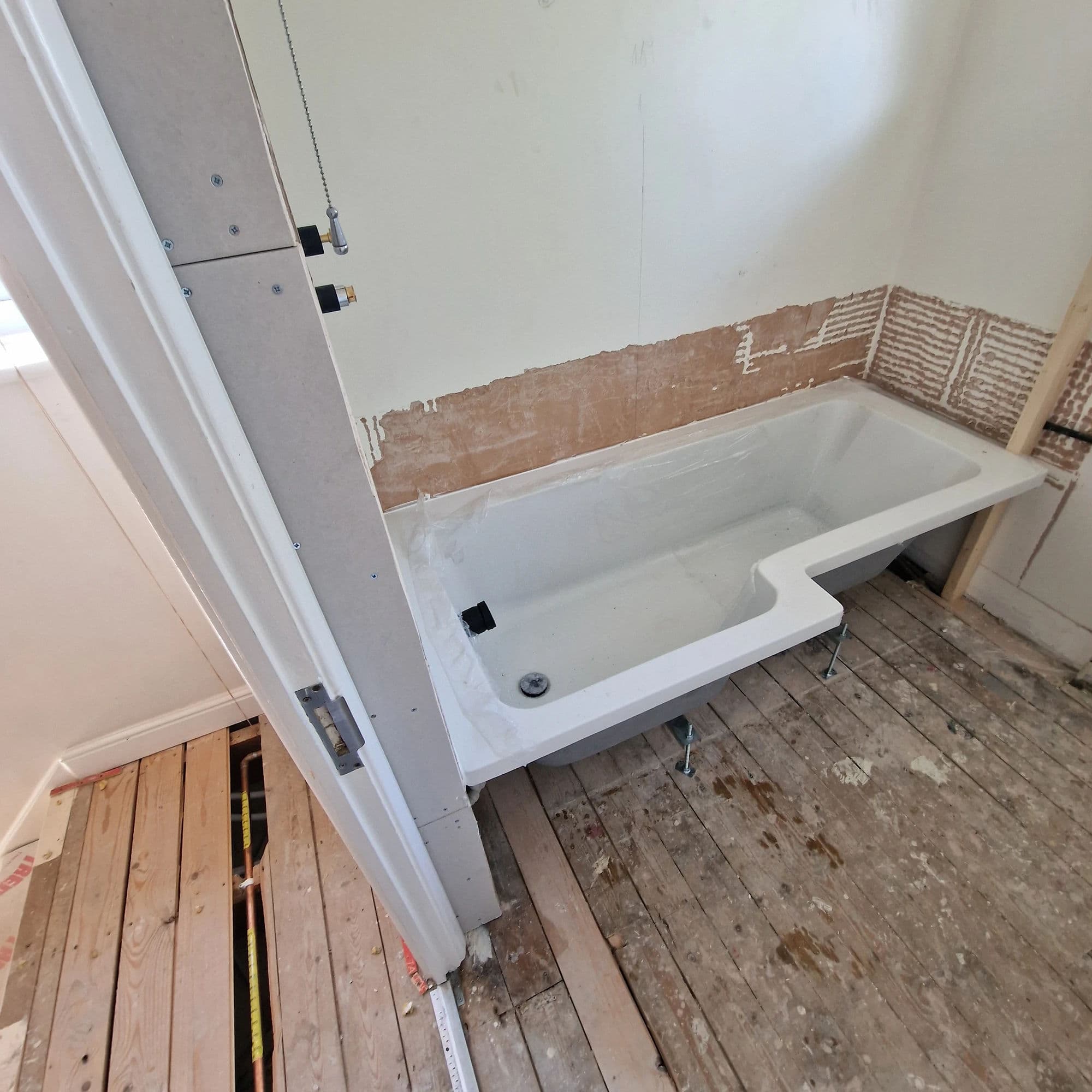 Ingleby Barwick Bespoke Bathroom Installation with Concealed Rainfall Shower in Ingleby Barwick — before work began. Services: Bathtub Installation, Plumbing, Flooring, Bathroom Tiling, Bathroom Refurbishment, Bathroom Installation, Shower Installation.
