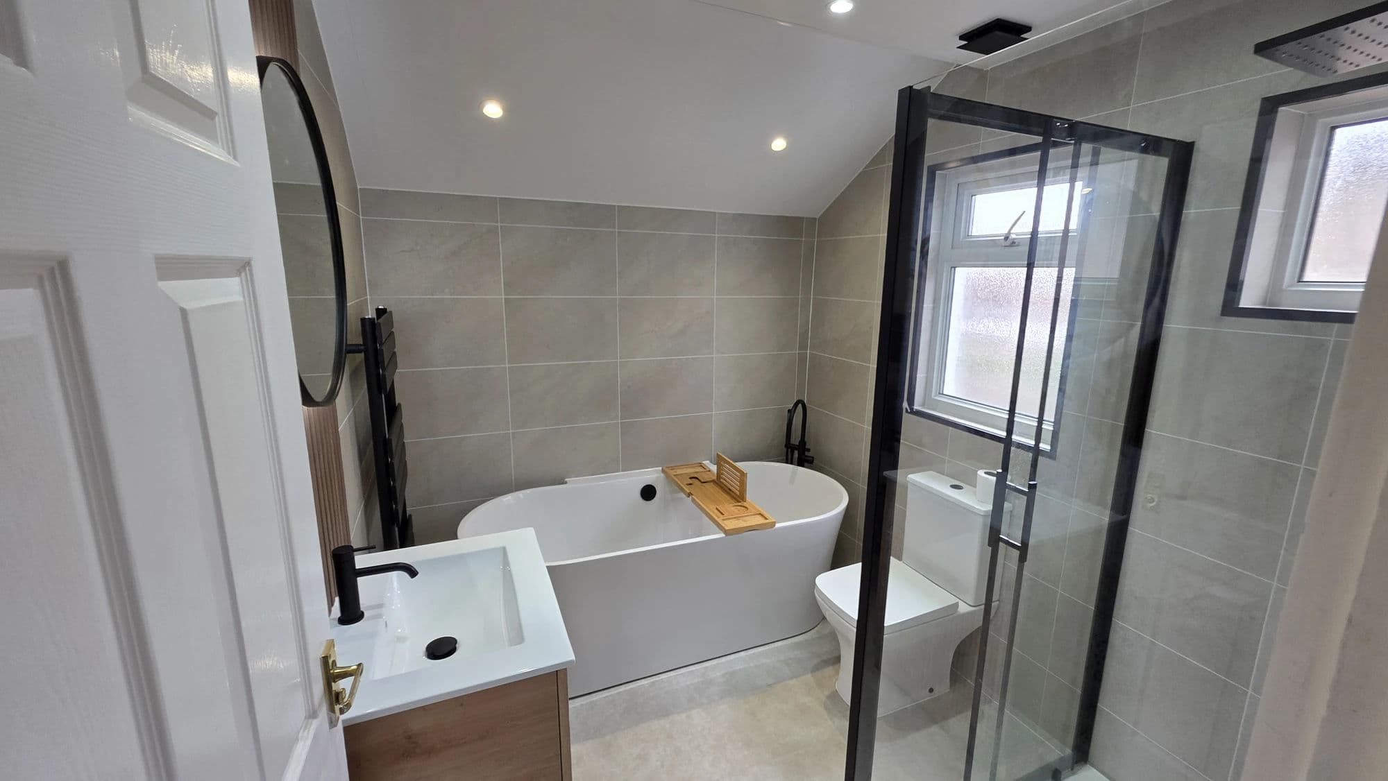 Middlesbrough Premium Bathroom Installation and Refurbishment with Freestanding Bath and Concealed Rainfall Shower in Middlesbrough — after completion. Services: Bathroom Installation, Bathtub Installation, Lighting, Plumbing, Flooring, Shower Installation, Bathroom Tiling, Bathroom Renovation, Bathroom Refurbishment.