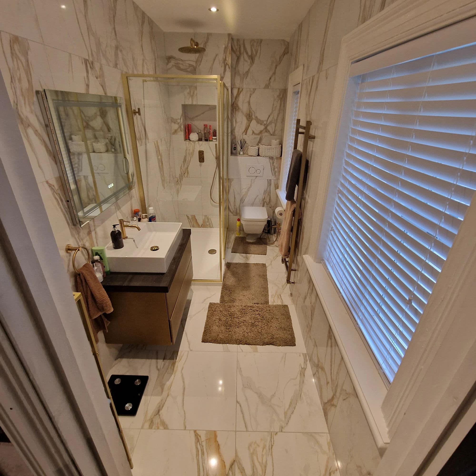 Thornaby High-Specification Bathroom Installation with Walk-In Shower and Large-Format Marble-Effect Tiles in Thornaby — after completion. Services: Bathroom Installation, Shower Installation, Plumbing, Lighting, Flooring, Bathroom Tiling, Shower Room.