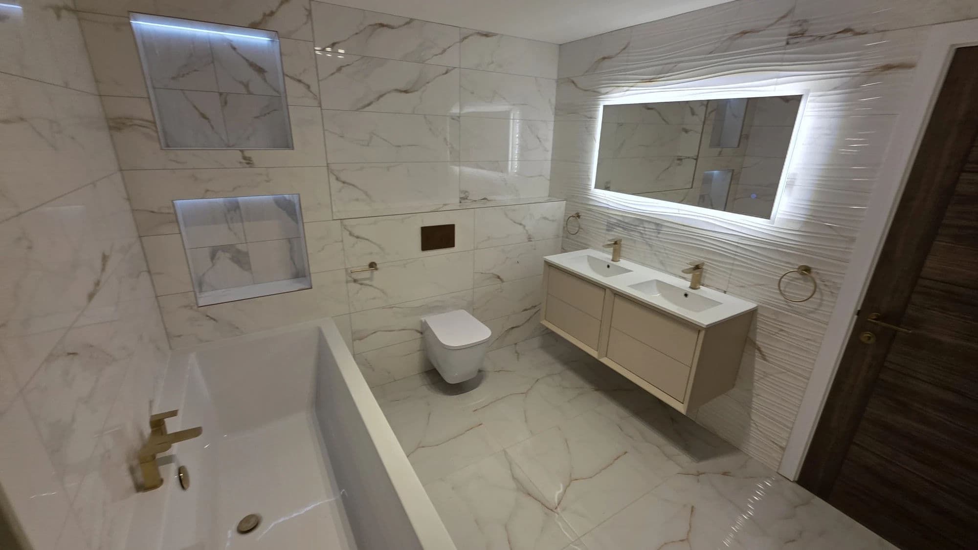 Bathroom Fitting Hartlepool with Bath and Double Vanity in Hartlepool — after completion. Services: Bathroom Installation, Plumbing, Bathroom Tiling.