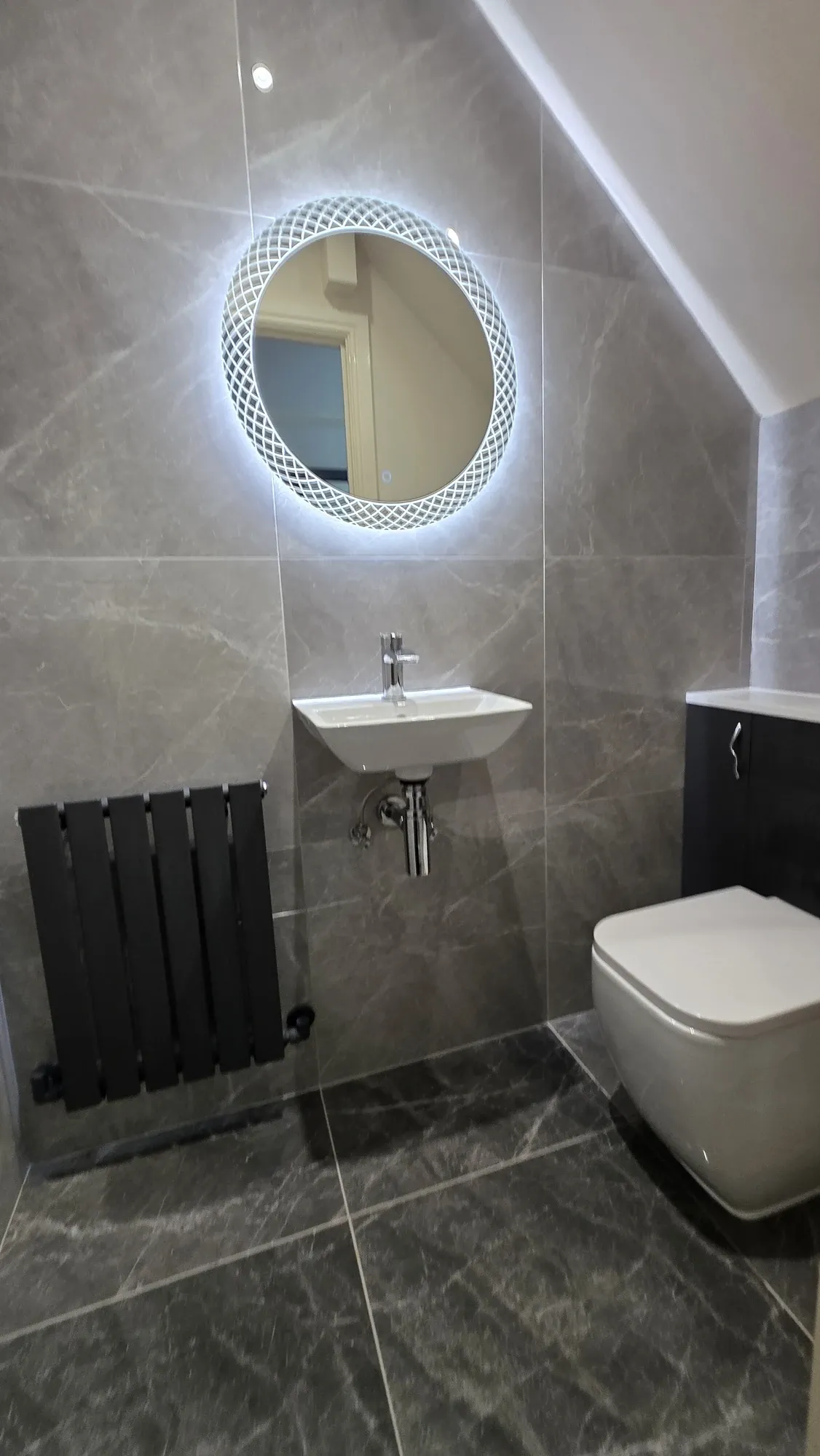 Downstairs WC Refurbishment Hartlepool with Full-Height Tiling in Hartlepool — after completion. Services: Bathroom Renovation, Bathroom Refurbishment, Bathroom Installation, Plumbing, Lighting, Flooring, Bathroom Tiling.