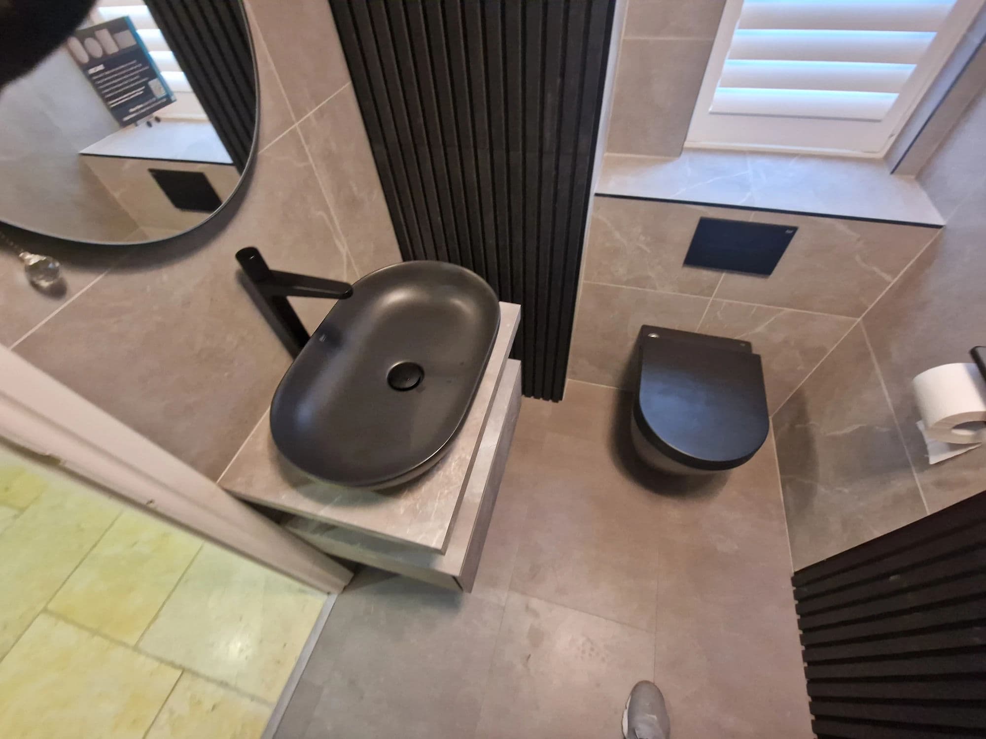 Yarm Cloakroom Installation with Slatted Access Doors in Yarm — after completion. Services: Bathroom Installation, Bathroom Renovation, Bathroom Refurbishment, Bathroom Tiling, Plumbing, Flooring.